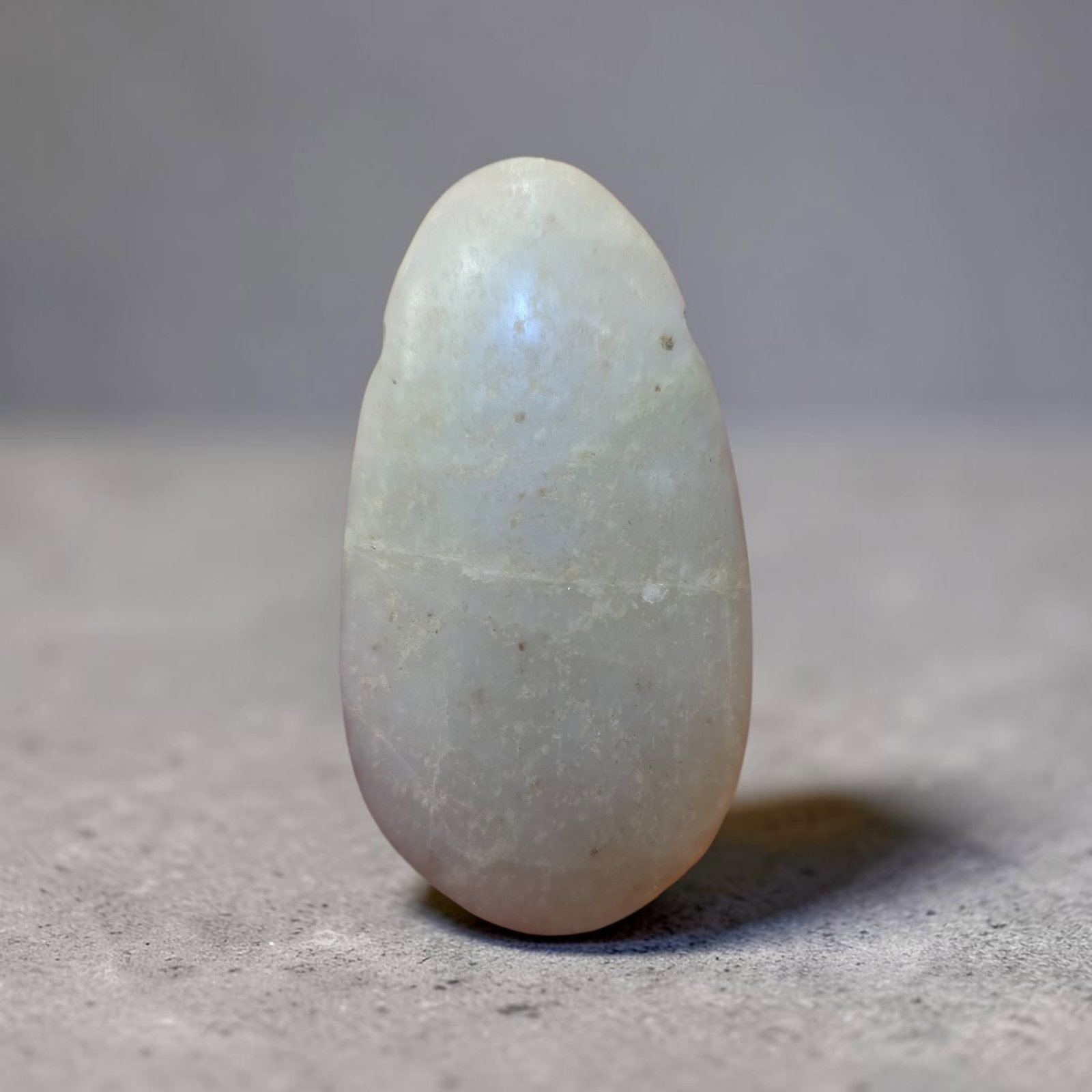 Pre-Columbian Jade Avian Celt, Costa Rica: 1.5" x 2.25", Pre-Columbian Jade Avian Celt, Carved Jade Celt with Faint Avian Features, Ceremonial Half Back, Erosion, Mineral Deposits, Calcification, Translucent Jade, Nicoya Costa Rica 600-1200
