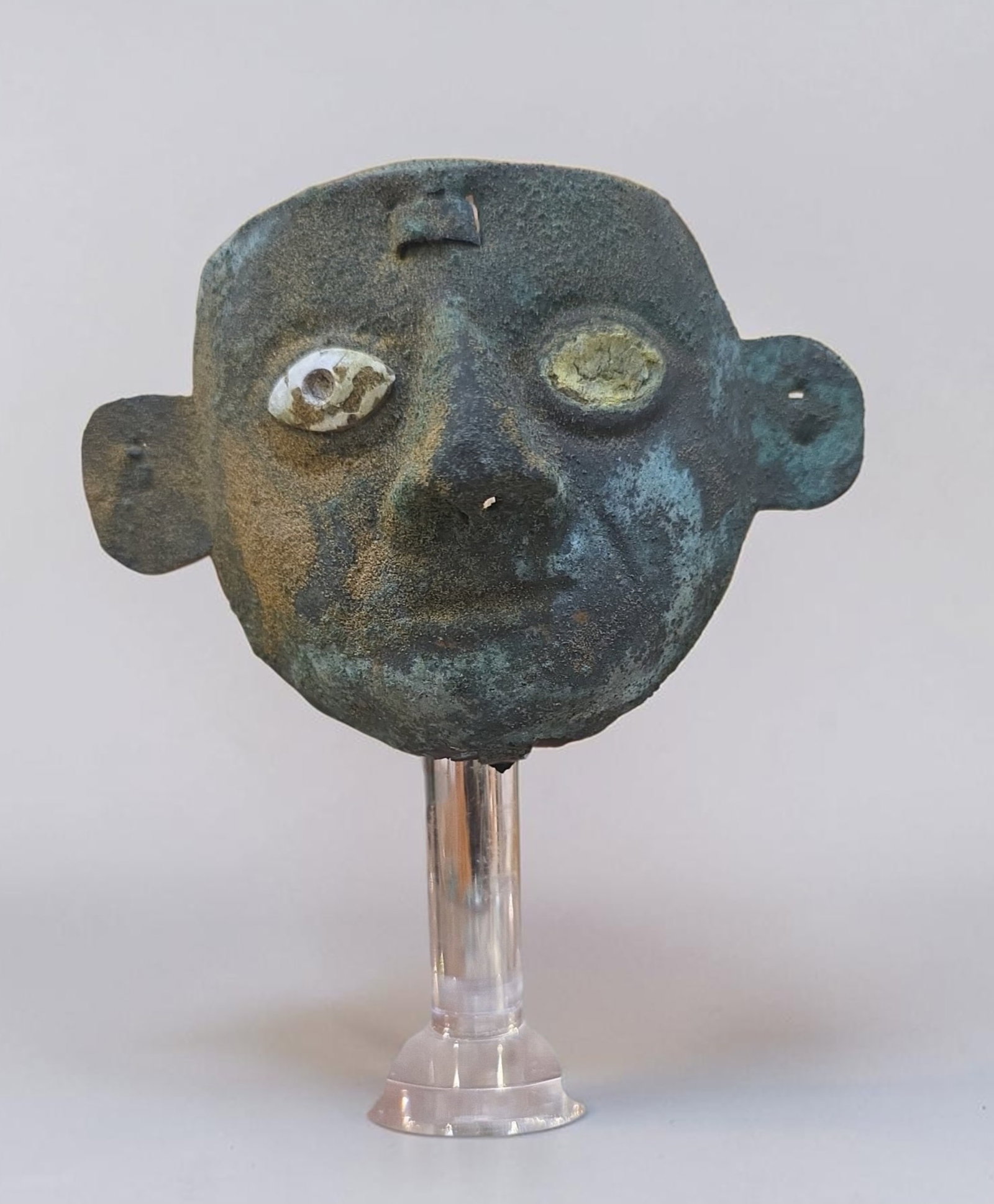 Pre-Columbian Moche Stylized Ceremonial Mask, Copper: 3" x 3.75", Pre-Columbian Moche Stylized Ceremonial Mask, Copper , Heavy Patina, Inlaid Shell Eyes, Prominent Ears, Stylized Nose, Circular Eyes, Moche Culture, 200-700 C.E.