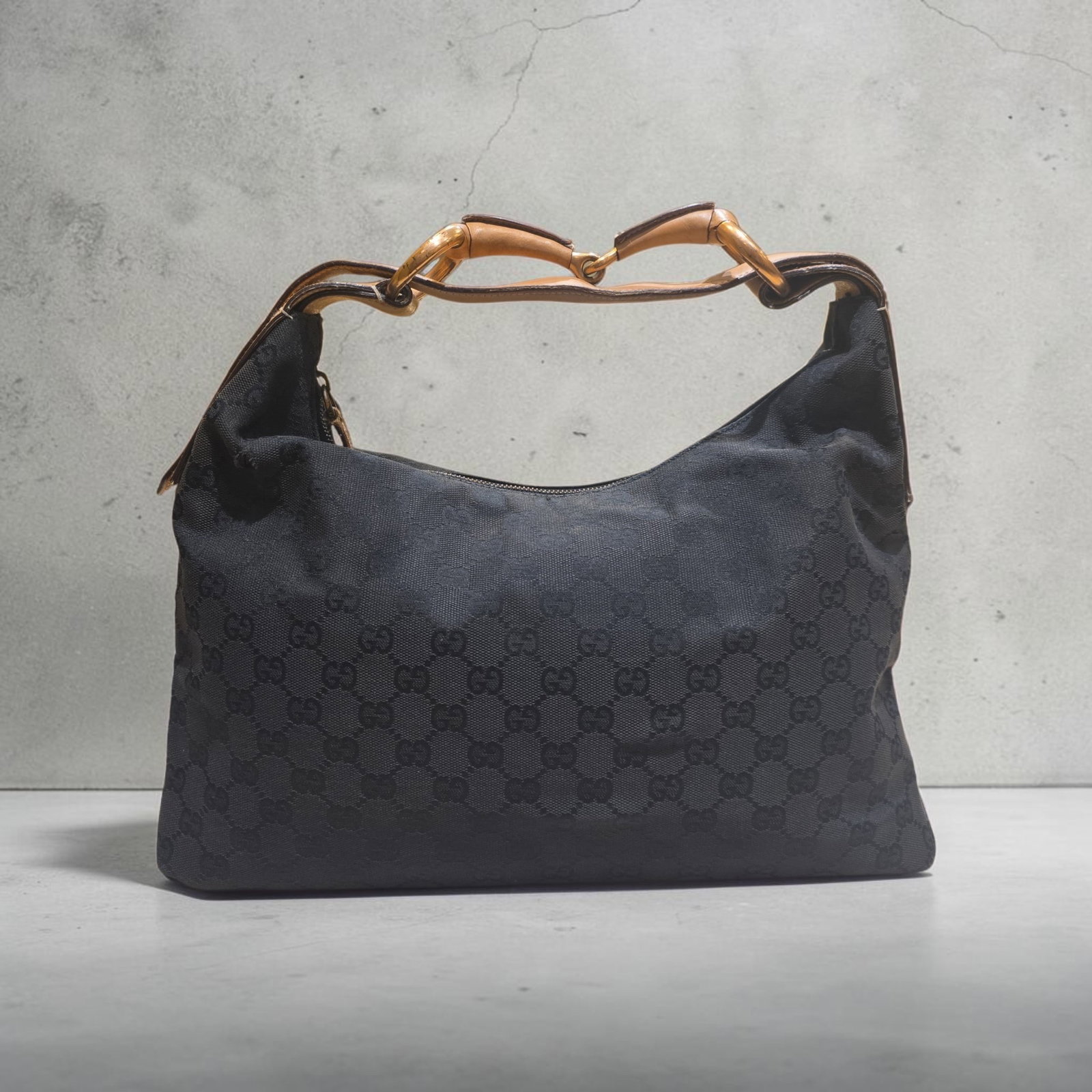 Authentic Gucci GG Canvas Horsebit Shoulder Bag: 14.6" x 9.8" x 3.5" Authentic Gucci GG Canvas Horsebit Shoulder Bag Gucci horsebit bag from the Tom Ford era. An iconic hobo style, it?s crafted with sleek black monogram fabric and beige leather, Som