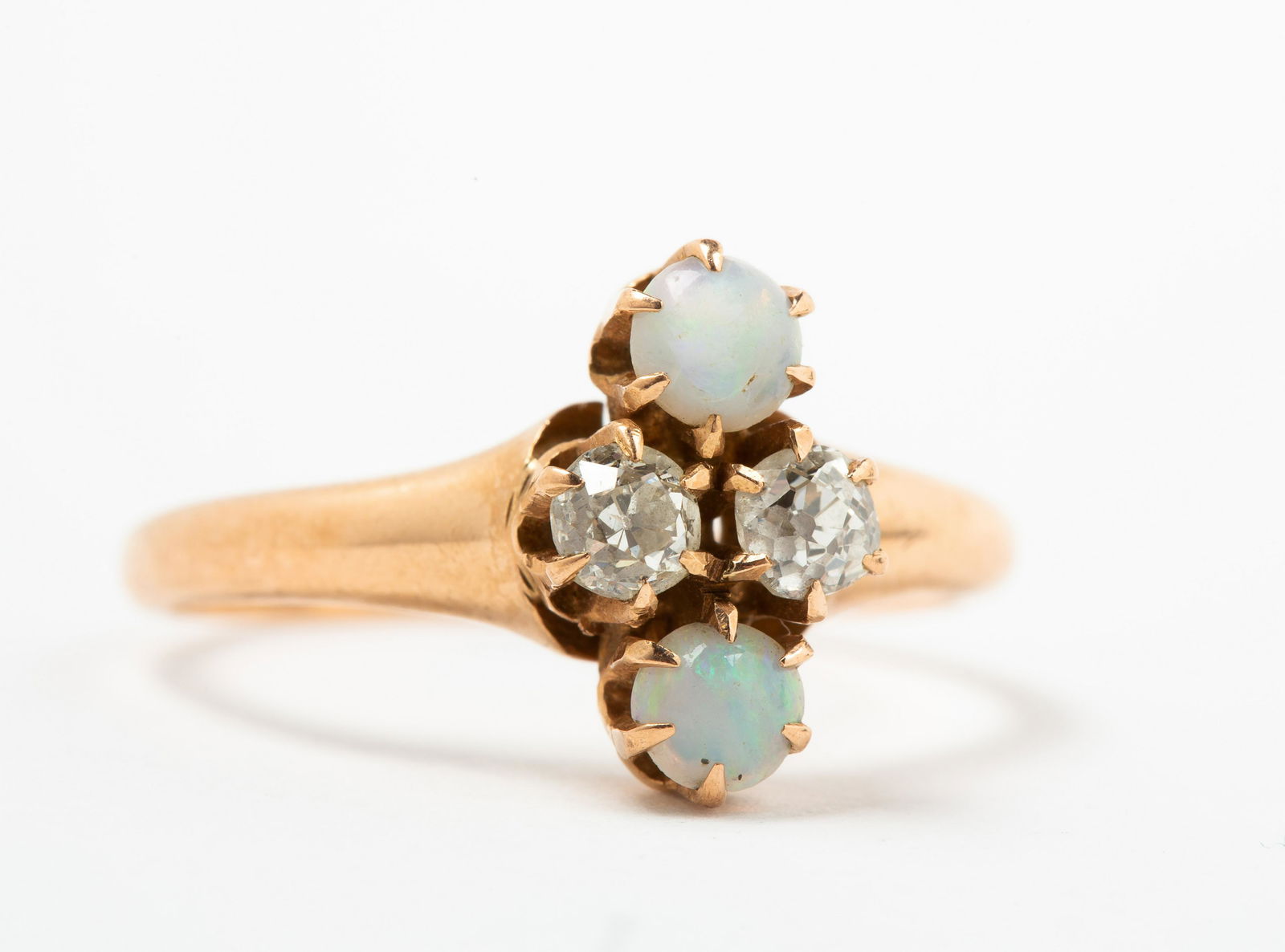 Antique Diamond and Opal Ring: Antique Diamond and Opal Ring, Marked on inner shank, "14", two approx. 3mm mine cut diamonds and two opal cabochons, each set in six prongs, set in rosy 14k gold, opal shows some wear from age and us