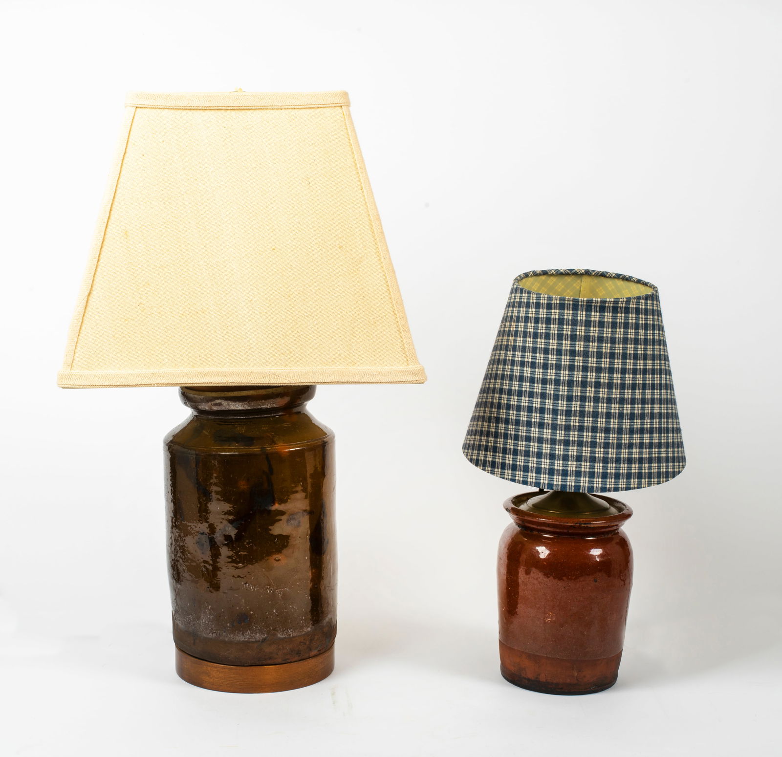 Two Redware Jar Pottery Converted Lamps: Includes: a smaller redware jar with a clear glaze, noticeable chip to rim, other small surface blemishes, the lamp attachment has been added in such as way to preserve the integrity of the jar,