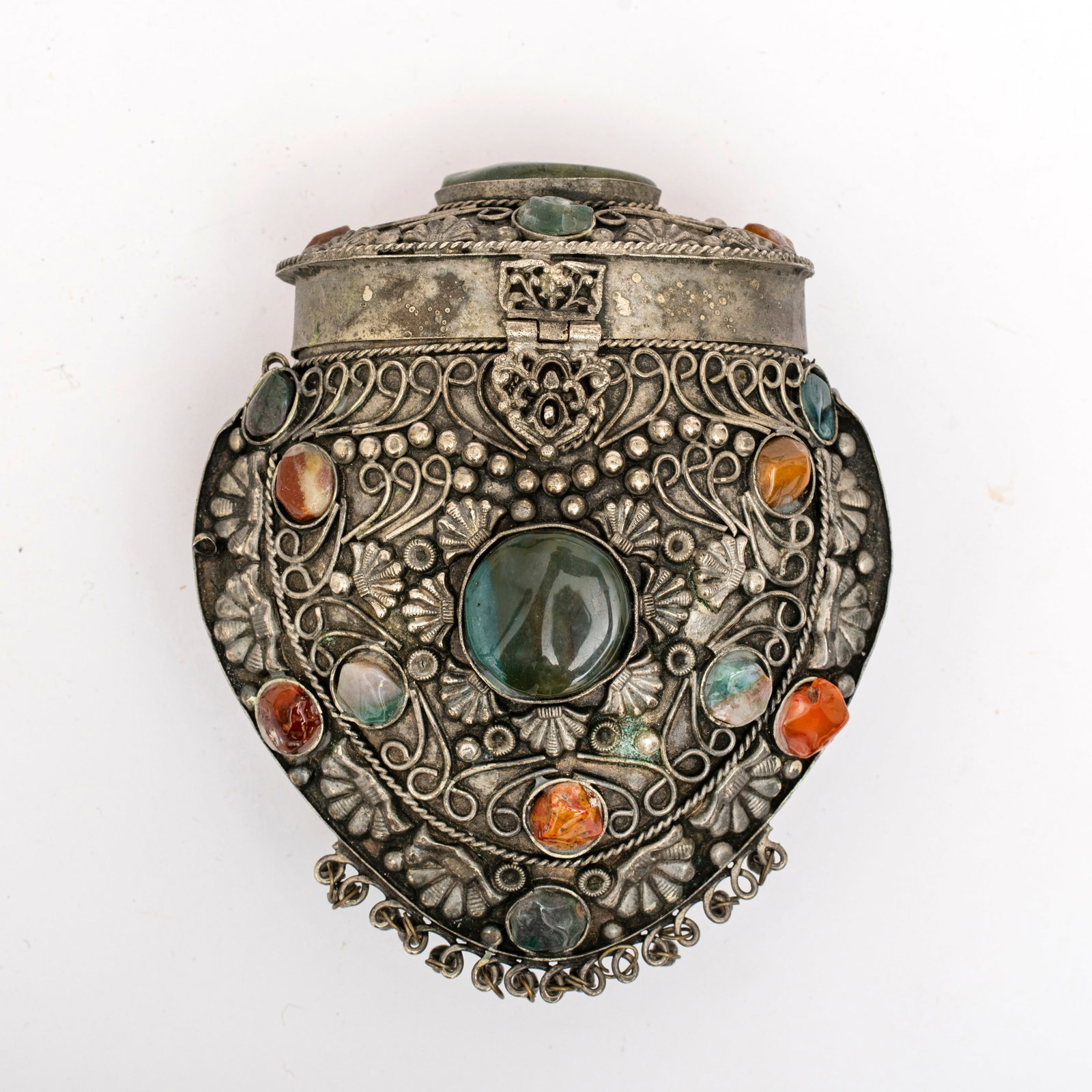 A Vintage Sajai Purse: Unmarked, silver tone metal construction with repousse and wire work details, agate and hard stone embellishment, lined with black fabric, with small bells around the bottom edge, appears to be m