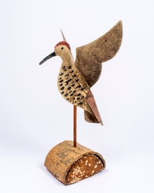 A Folk Art Painted Metal Hummingbird