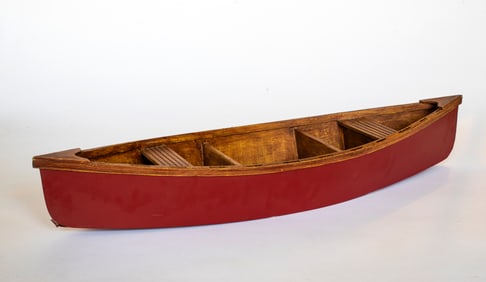 A Vintage Red Painted Wooden Canoe Model