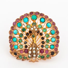 An Indian 8K Gold Peacock and Gemstone Brooch