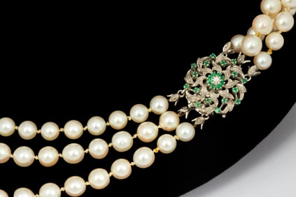 An Estate Akoya Pearl Three Strand Necklace with 18K Gold Emerald Clasp