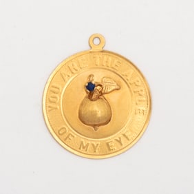 A Vintage 14K Gold Disk Charm