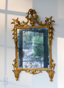 An Ornate Rococo Style Giltwood Mirror