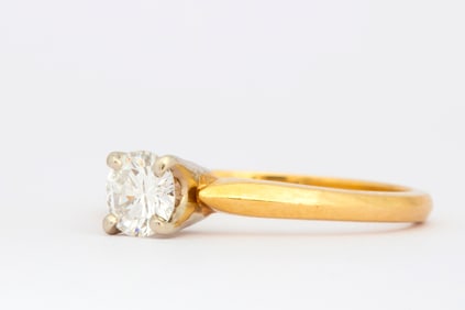 An 18K Gold Diamond Solitaire Ring