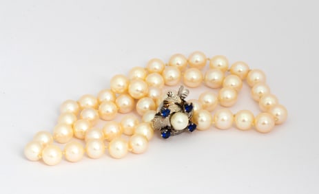 A Vintage Strand of Pearls with 14K White Gold Sapphire Clasp
