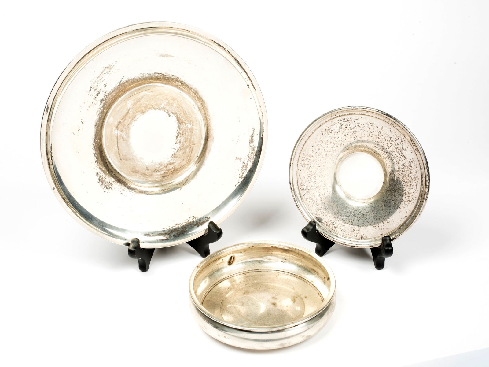 Two Sterling Silver Plates and Wine Coaster: All marked, including: a "Revere Silversmiths" wine coaster, 5 3/4" diameter, some dents to side; a small "Preisner" 6" plate; and a large 9 1/2" diameter plate, tot