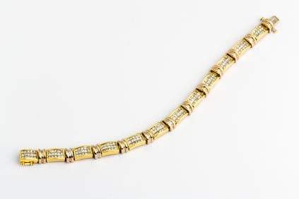 An 18K Gold Two Tone Invisible Set Diamond Bracelet