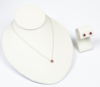 A White Gold Diamond and Ruby Necklace and Earring Set