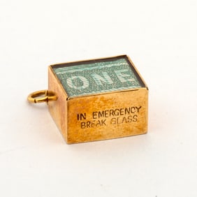 A Vintage 9K Gold "In Emergency Break Glass" Charm
