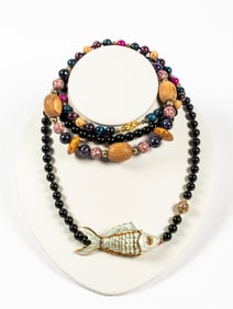 A Gold Tone Fish, Onyx and Multi Bead Necklaces