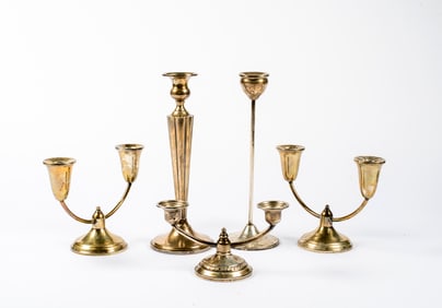 A Group of Sterling Weighted Candle Holders