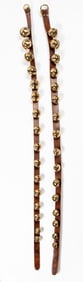 A Set of Antique Brass Sleigh Bells on Leather Straps
