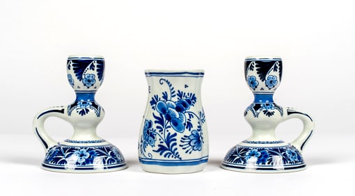 A Pair of Delft Candlesticks and Vase