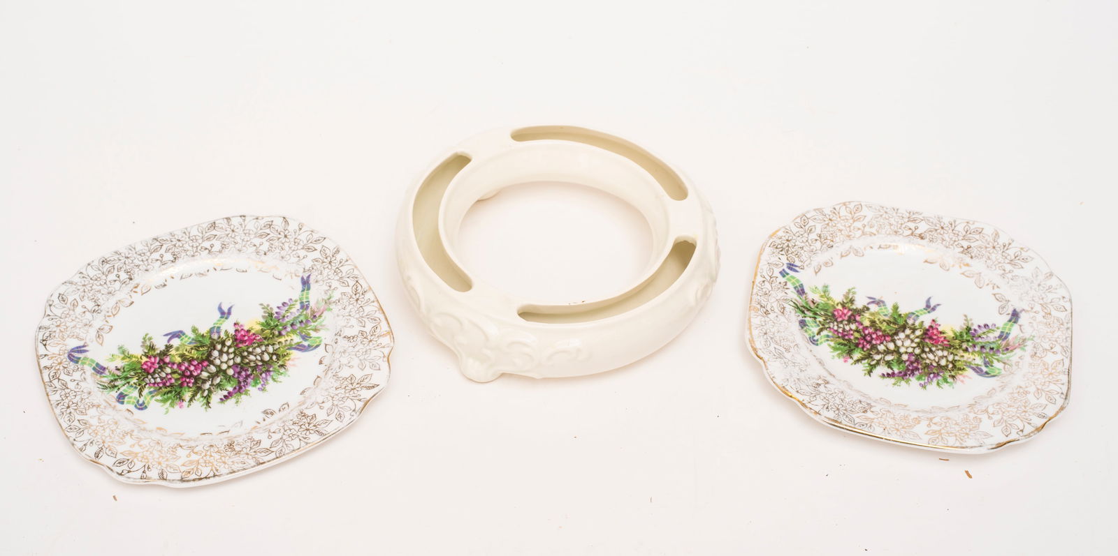 A Group of Antique Plates: Includes: five transfer ware dinner size plates, two in blue and the rest in brown; two small floral and gold decorated plates; a fruit decorated plate and a Goebel hummel flower ring.