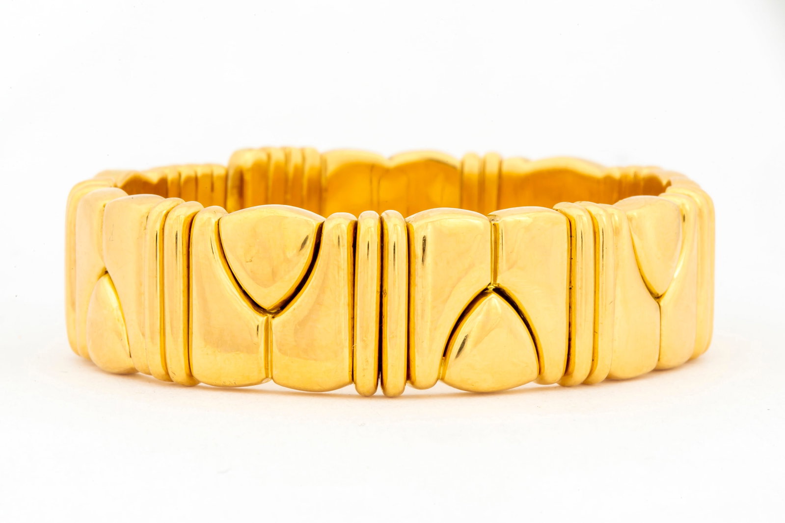 Vintage 18K Gold Acciaio Foro Bracelet: Marked on inner end, "Acciaio Foro, 750", flexible cuff bracelet with geometric design, 16mm widest and an inner diameter of 2 1/16" widest, the ends are slightly out of alignment, the total weight is