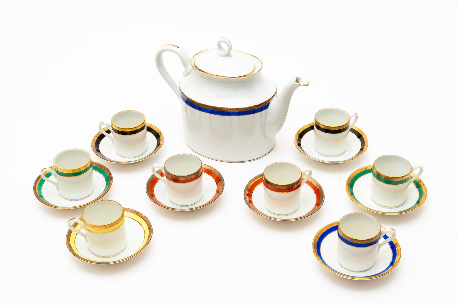 A Set of Eight Vintage Richard Ginori Demitasse Cups and Coffee Pot: Each marked on the bottom, "Richard Ginori, Italy, Finest in China Since 1735", each in cream color with a band of color and gold rim and accents, two in black, two in red, two in green, one blue and
