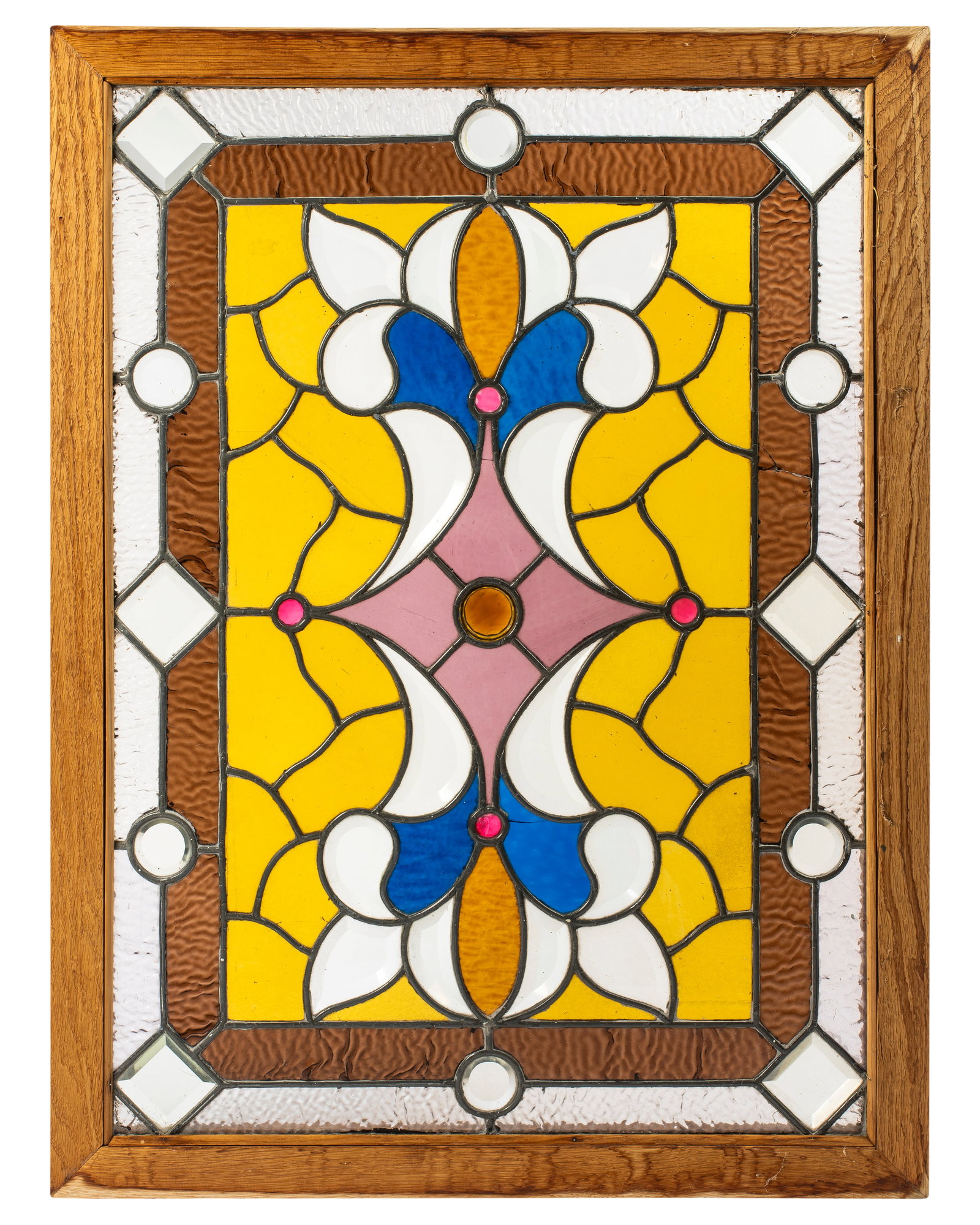 An Antique Leaded Stained Glass Window: Multicolored jeweled window with beautiful pattern, 36 1/2" x 27 1/2" overall framed size.