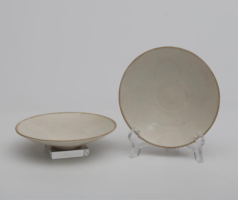 A PORCELAIN PLATE, DING KILN, SONG DYNASTY. (1 of 7)
