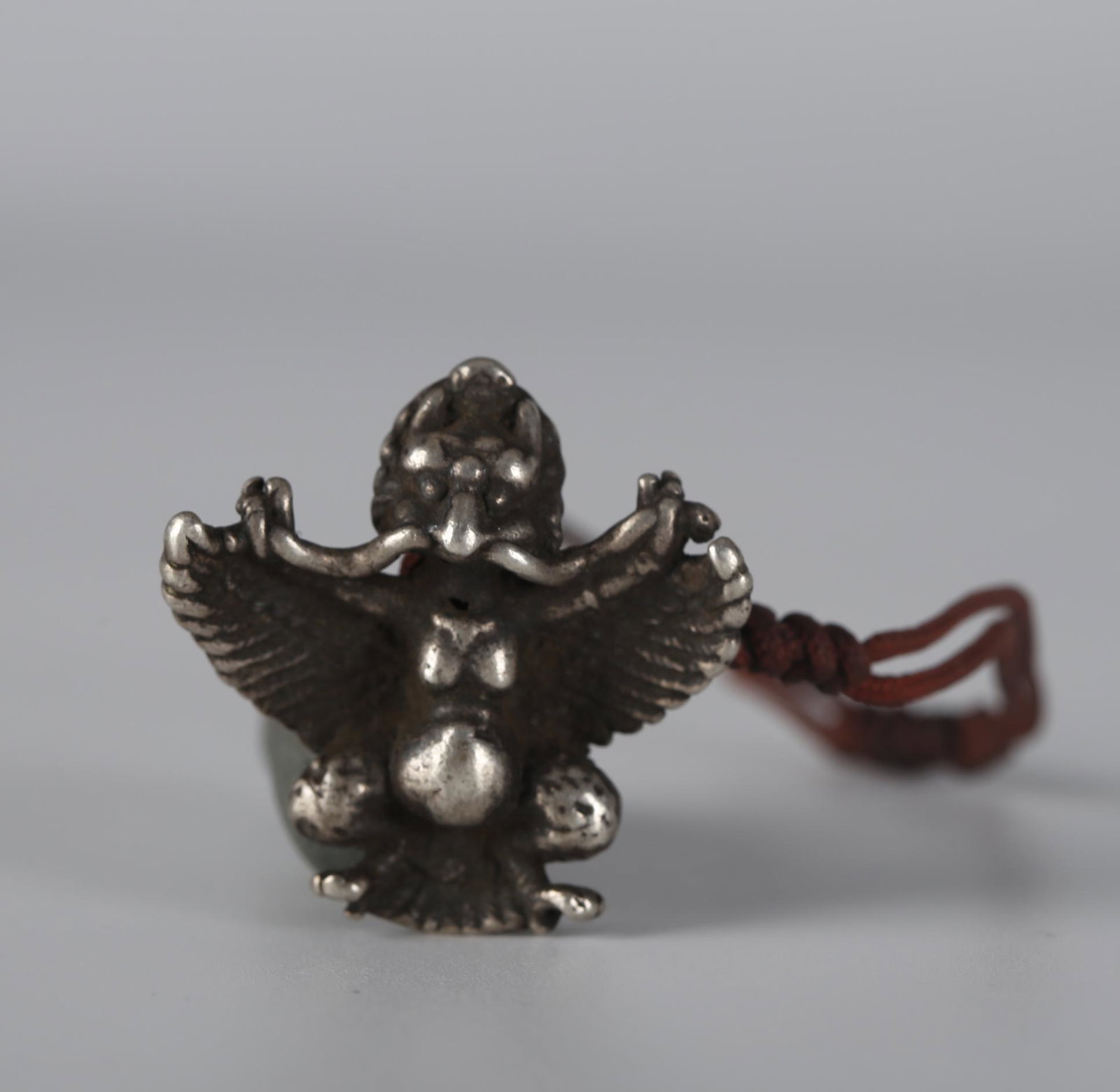 A ROC-SHAPED SILVER PENDANT, QING DYNASTY.: Roc-Shaped Silver Pendant, Qing Dynasty.