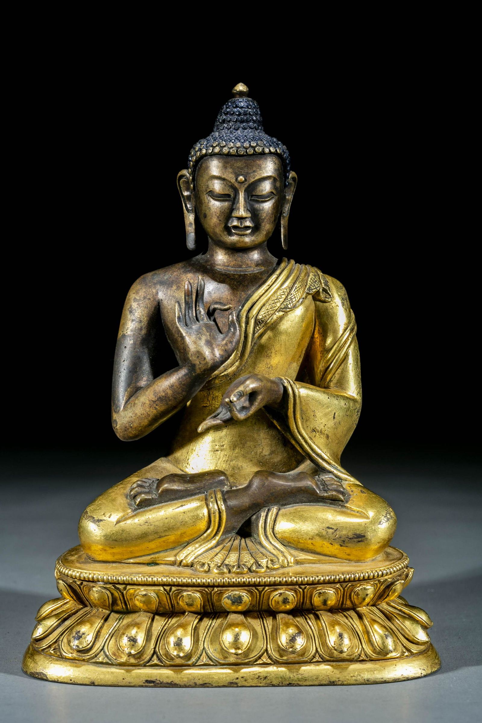A BRONZE CHANTING-SUTRAS SAKYAMUNI STATUE. (1 of 8)