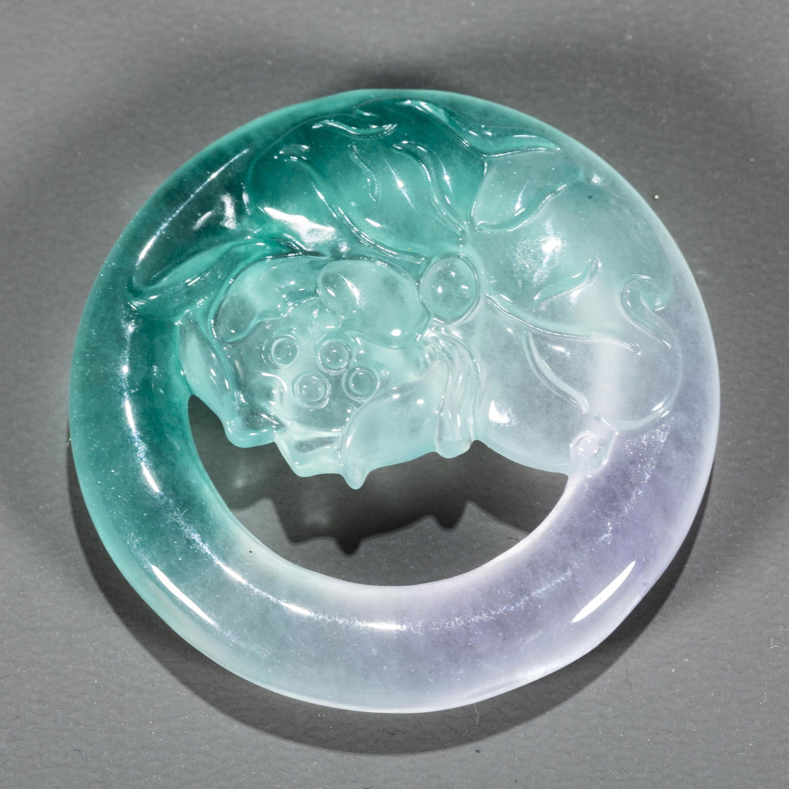 A JADEITE CARVING PENDANT, CARVED LOTUS DESIGN. (1 of 5)