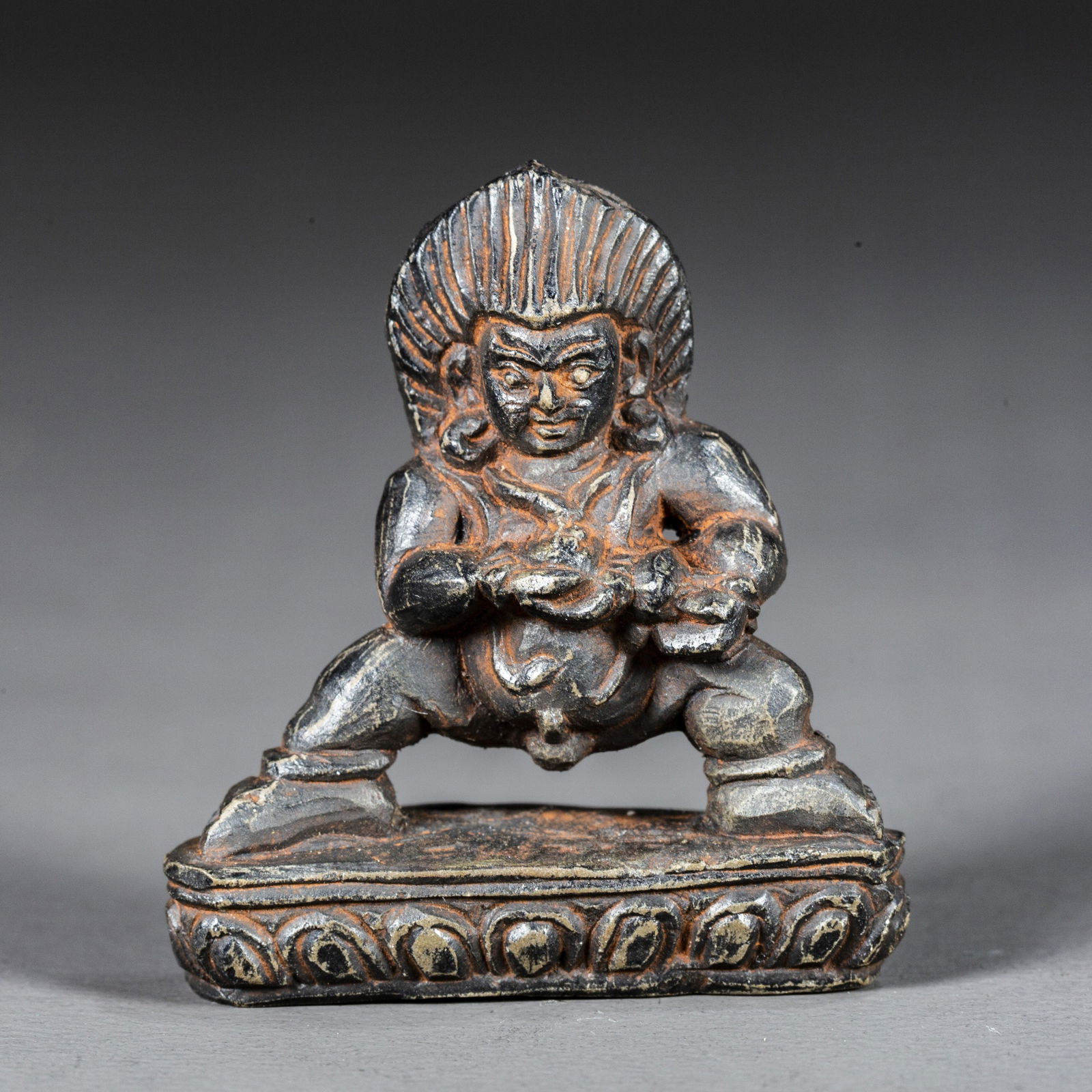 A BLACK STONE GOD OF WEALTH BUDDHA STATUE. (1 of 5)