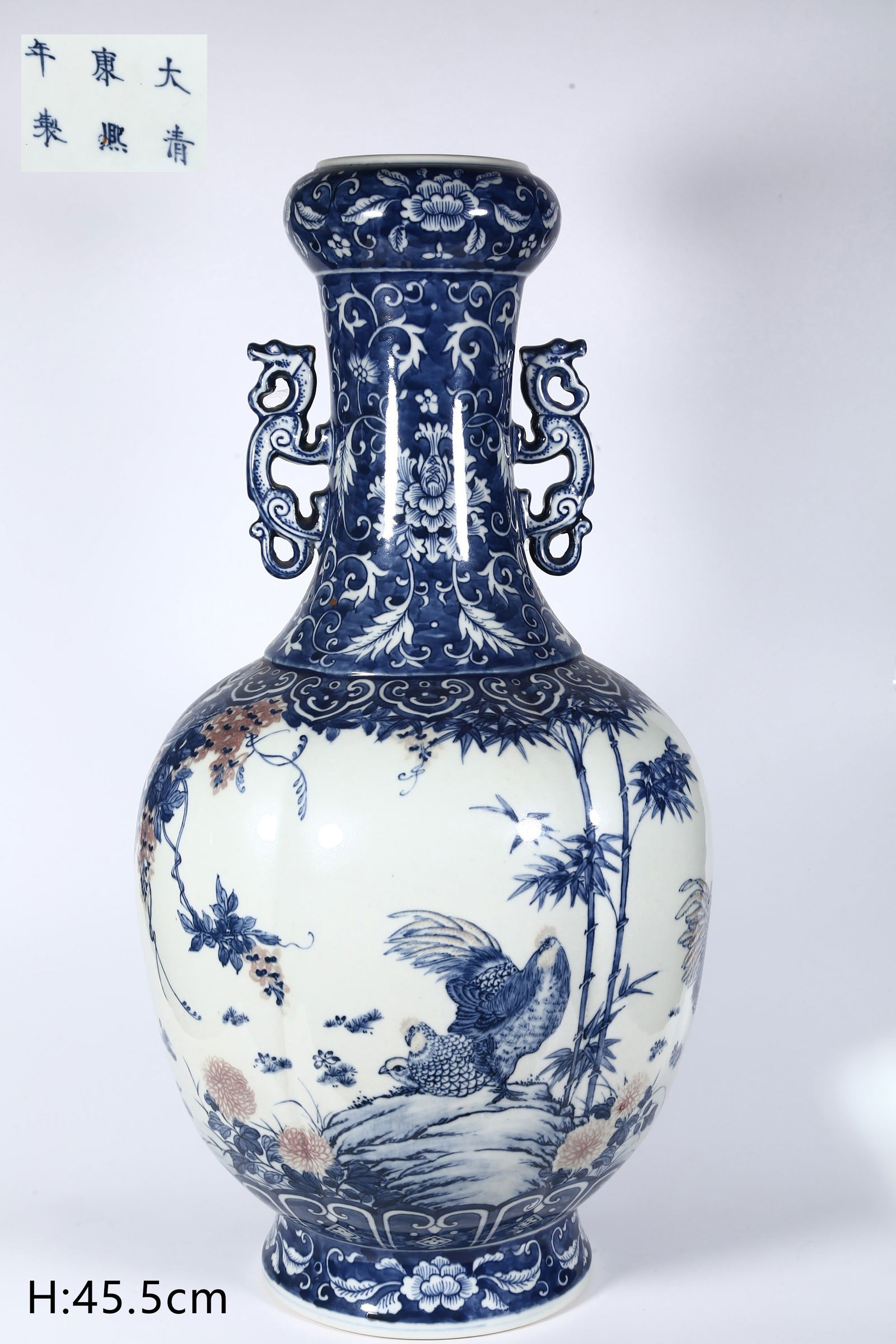 A BLUE-AND-WHITE PORCELAIN BOTTLE.: Blue-and-White Porcelain Bottle, with Underglaze-Red Rooster, Hen and Chicks Design, Symbolize Reunion, Dragon-Shaped Ears.