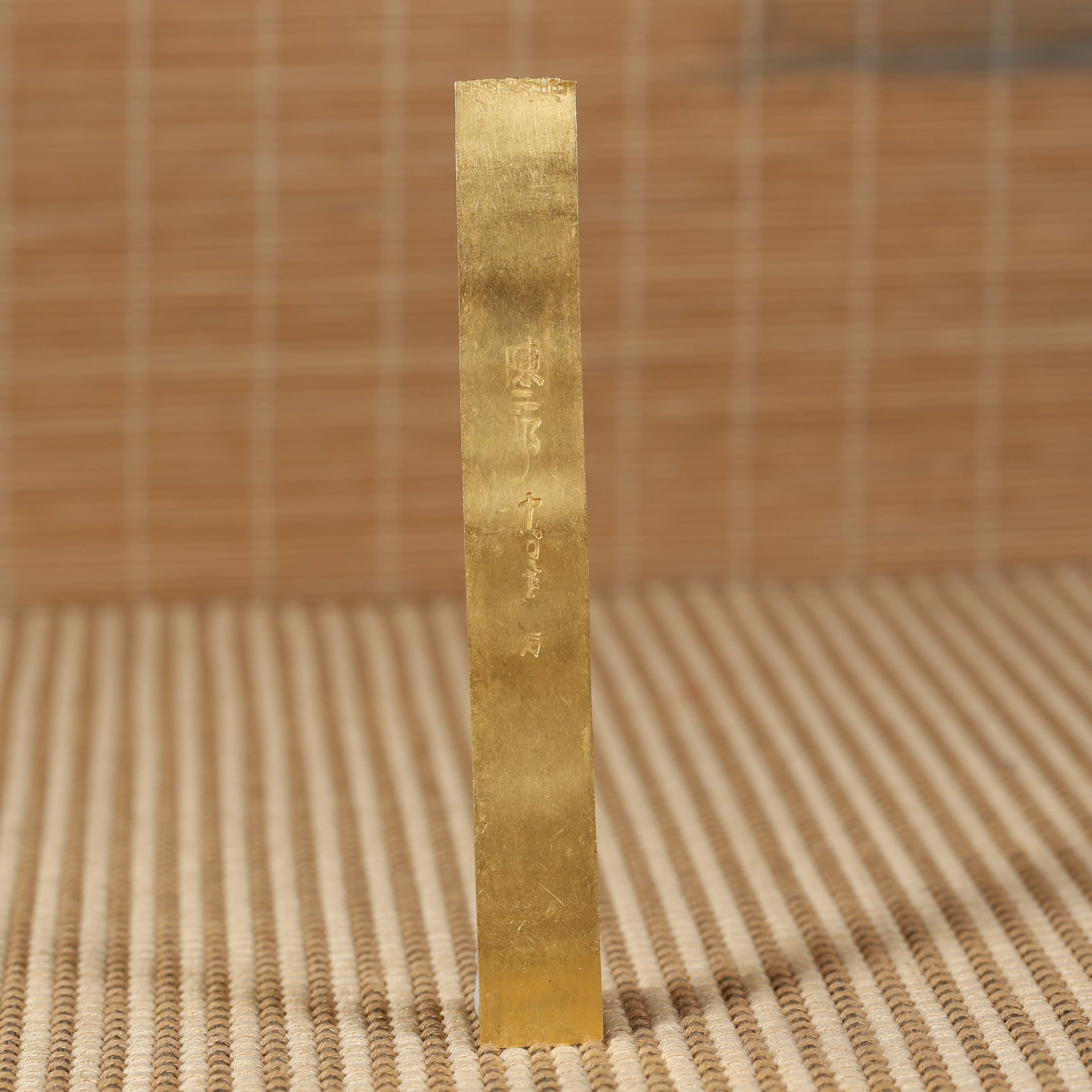 A SOLID GOLD INGOT, BEFORE MING DYNASTY. (1 of 6)