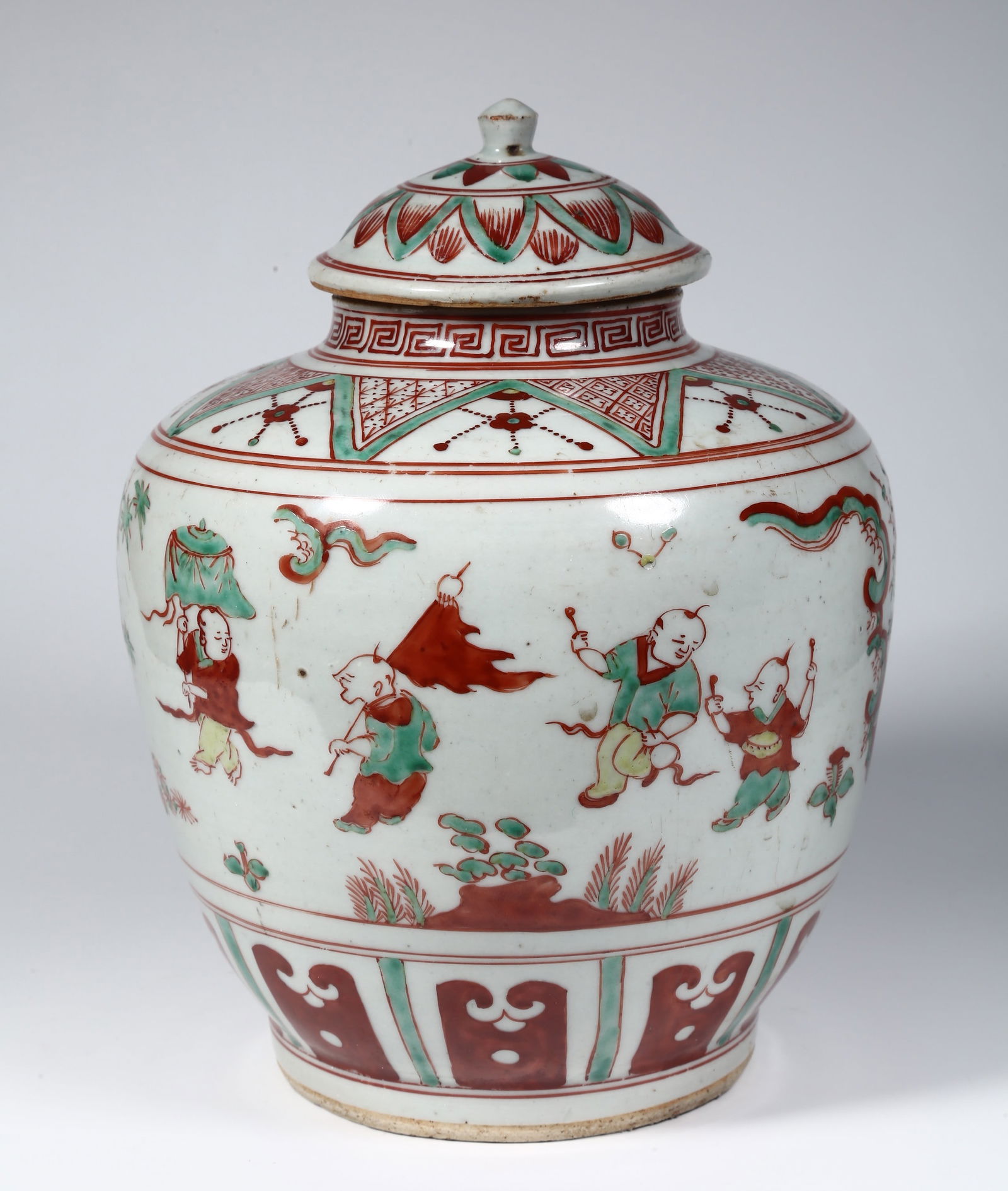 A PORCELAIN JAR WITH LID, WITH BOYS DESIGN.: Porcelain Jar with Lid, with Red and Green Boys Design.