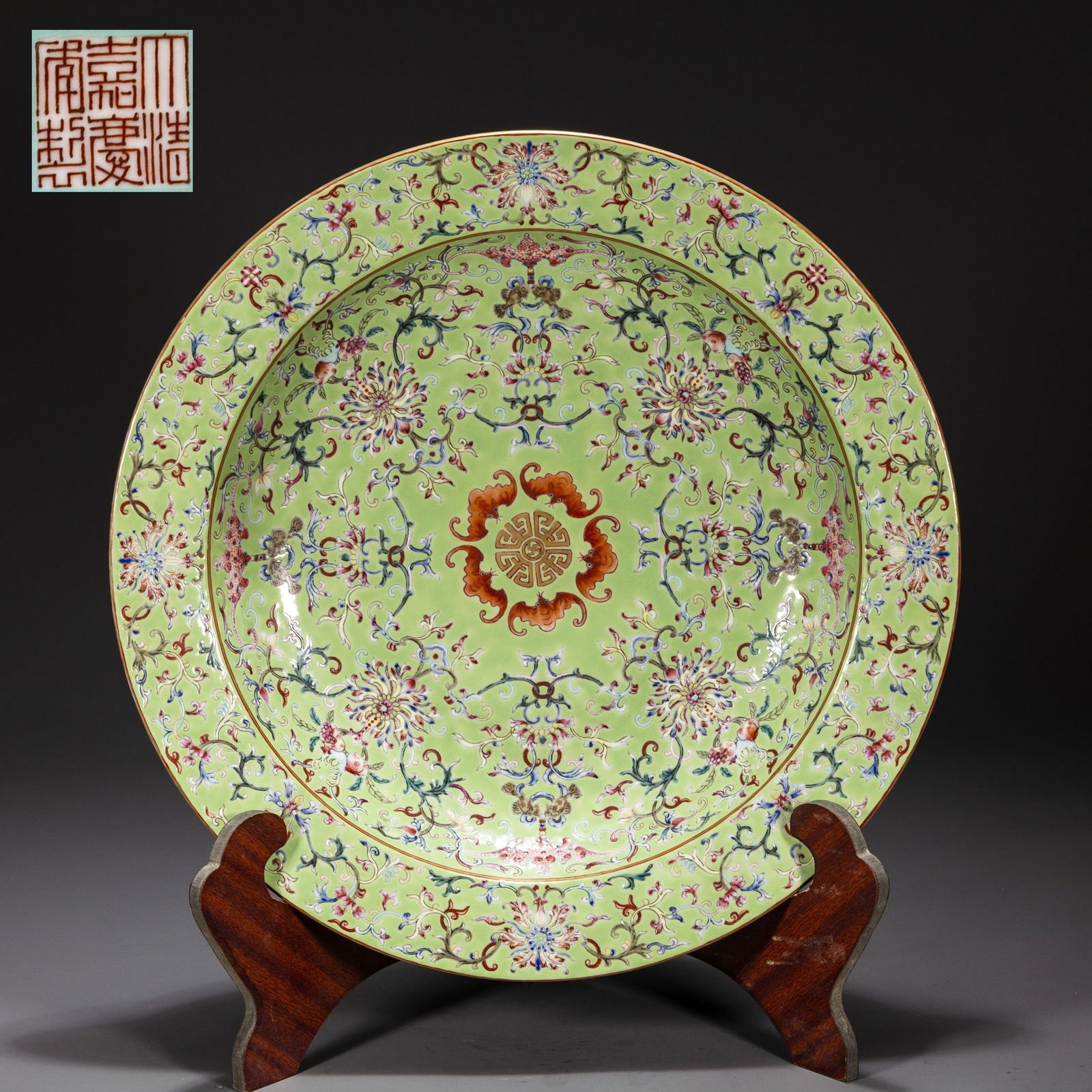 A GREEN PORCELAIN PLATE WITH FLOWERS DESIGN. (1 of 7)