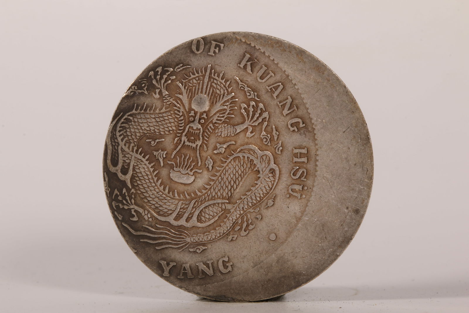 A SILVER DOLLAR COIN (1 of 4)