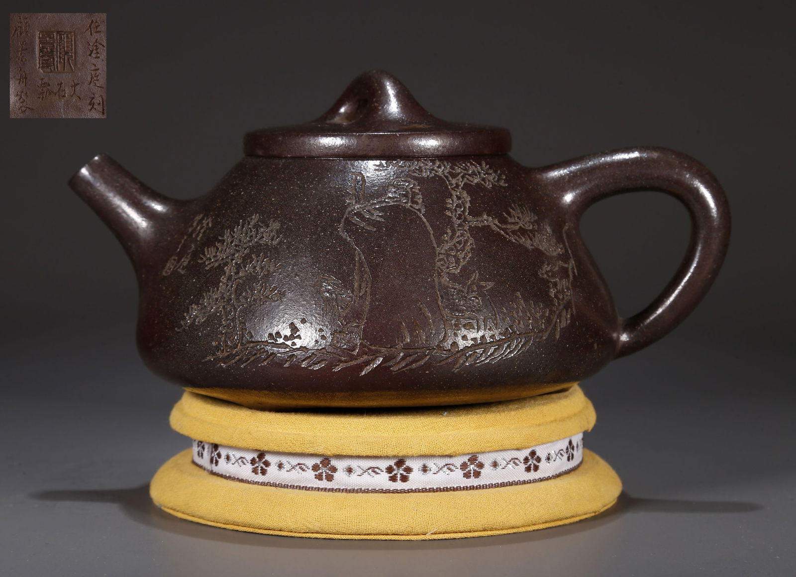 A PURPLE CLAY TEAPOT, CARVED ARHAT DESIGN. (1 of 9)