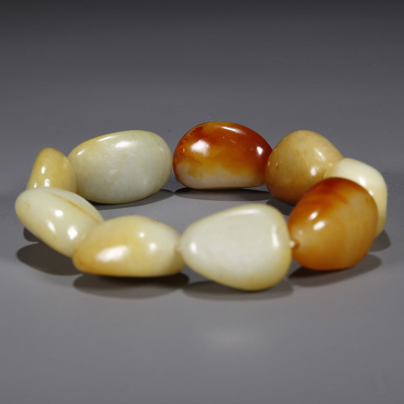 A HETIAN RAW JADE BRACELET. (1 of 8)