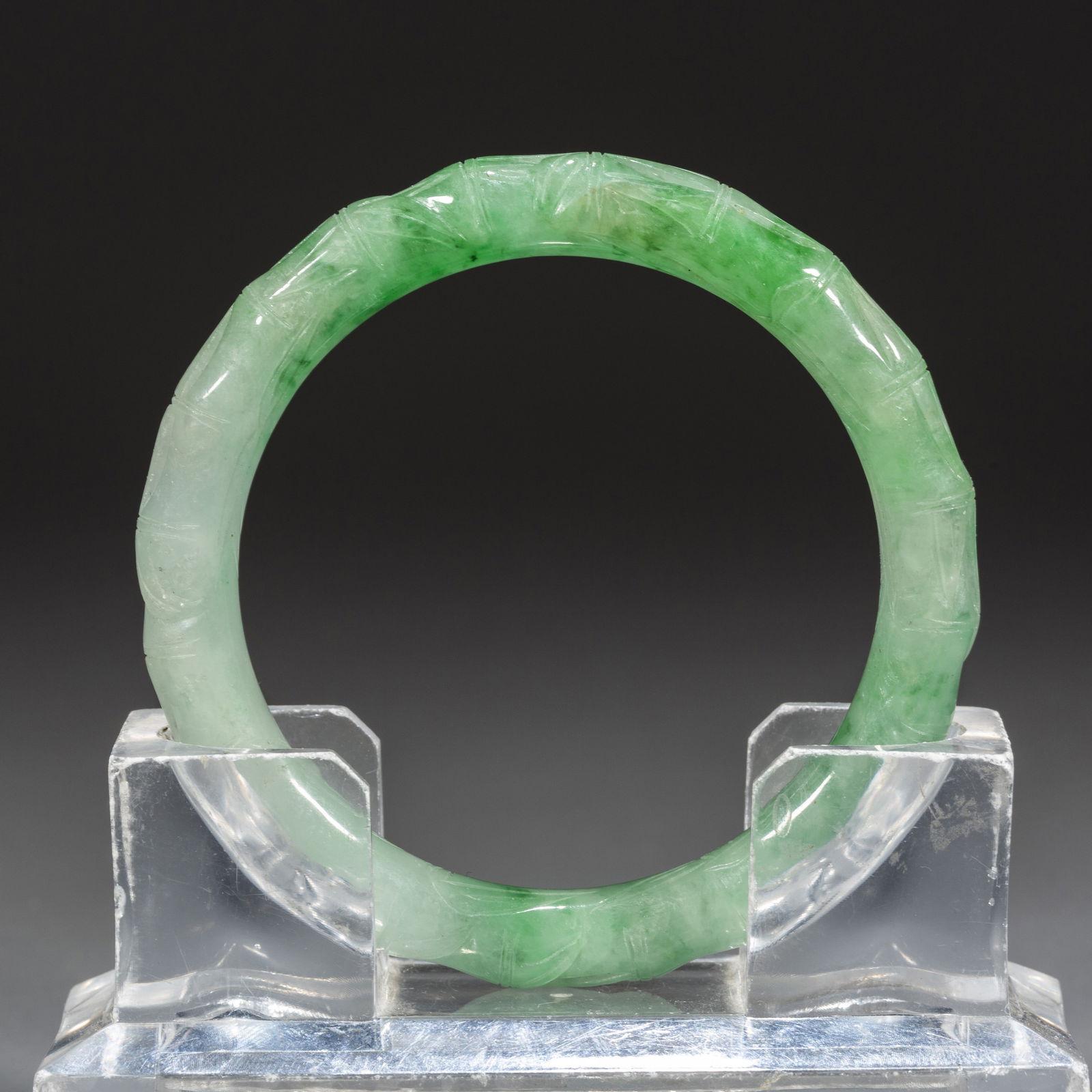 A BAMBOO-JOINT-SHAPED JADEITE BRACELET. (1 of 5)