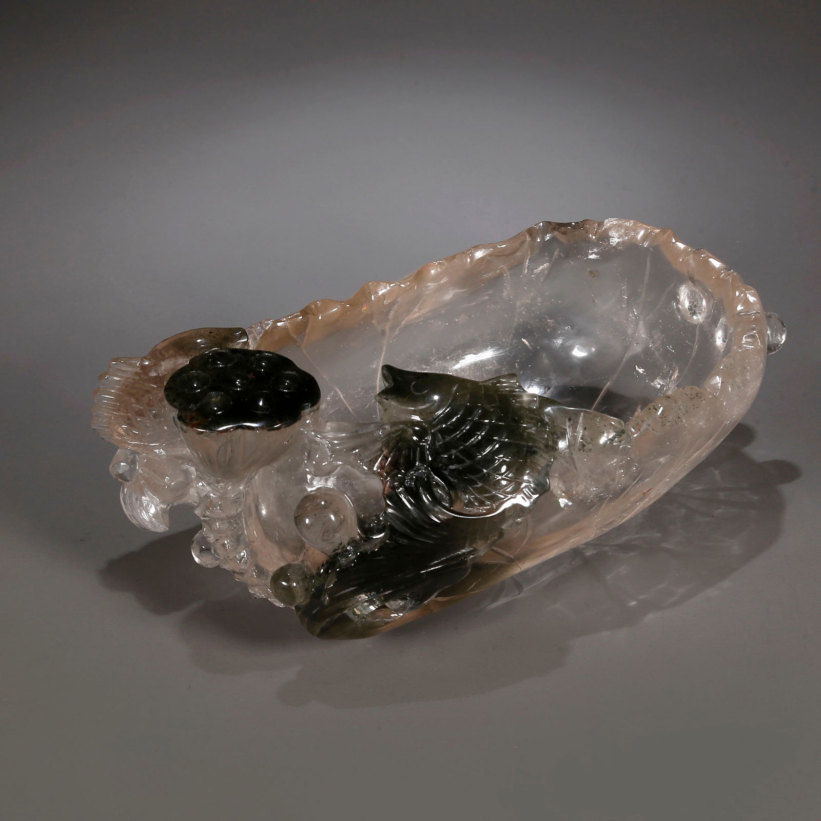 A LOTUS-LEAF-SHAPED CRYSTAL BRUSH WASHER.: Lotus-Leaf-Shaped Crystal Writing-Brush Washer, Carved Fish Design, Symbolize Auspiciousness and Riches.