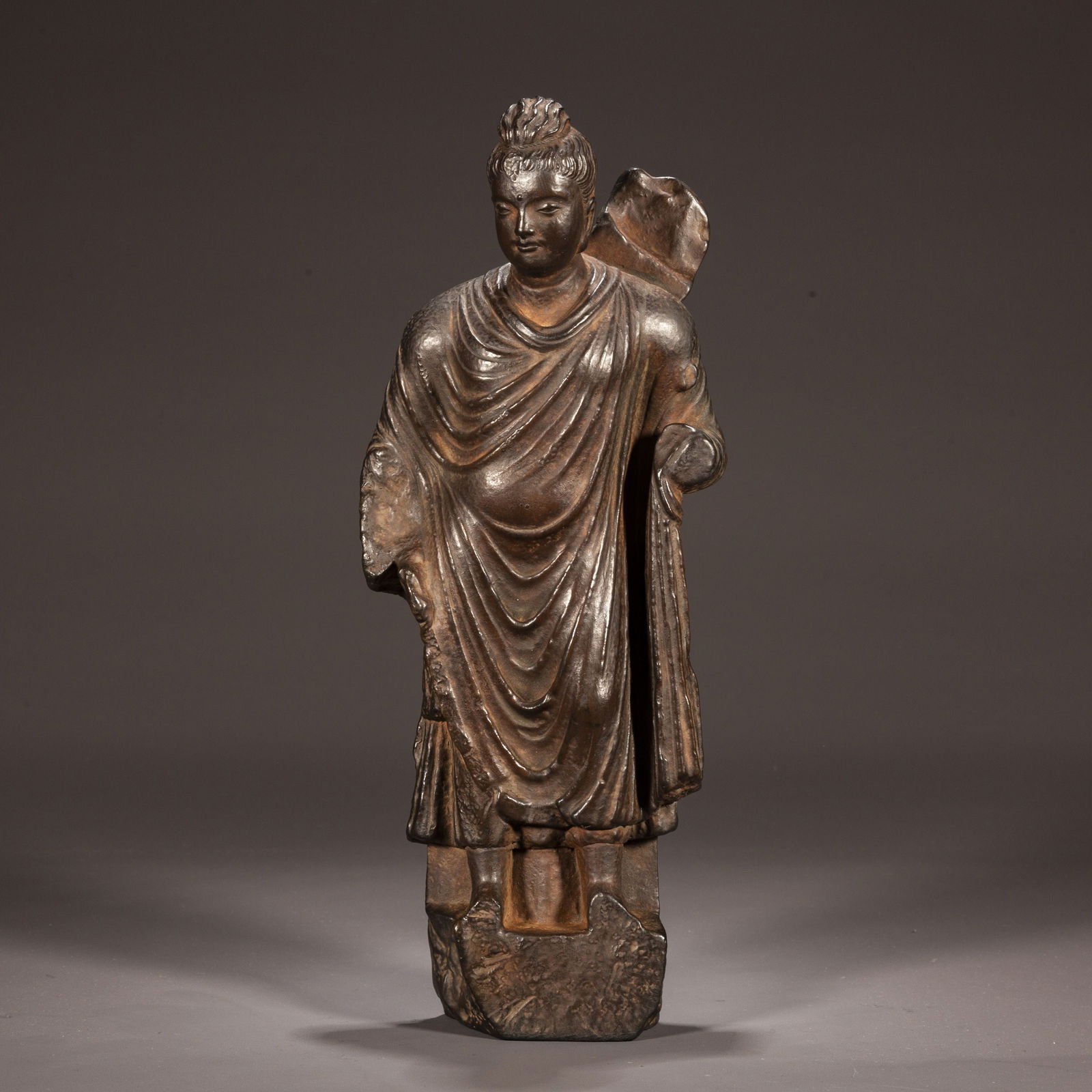 A CERAMIC GANDHARA-STYLE SAKYAMUNI STATUE. (1 of 6)
