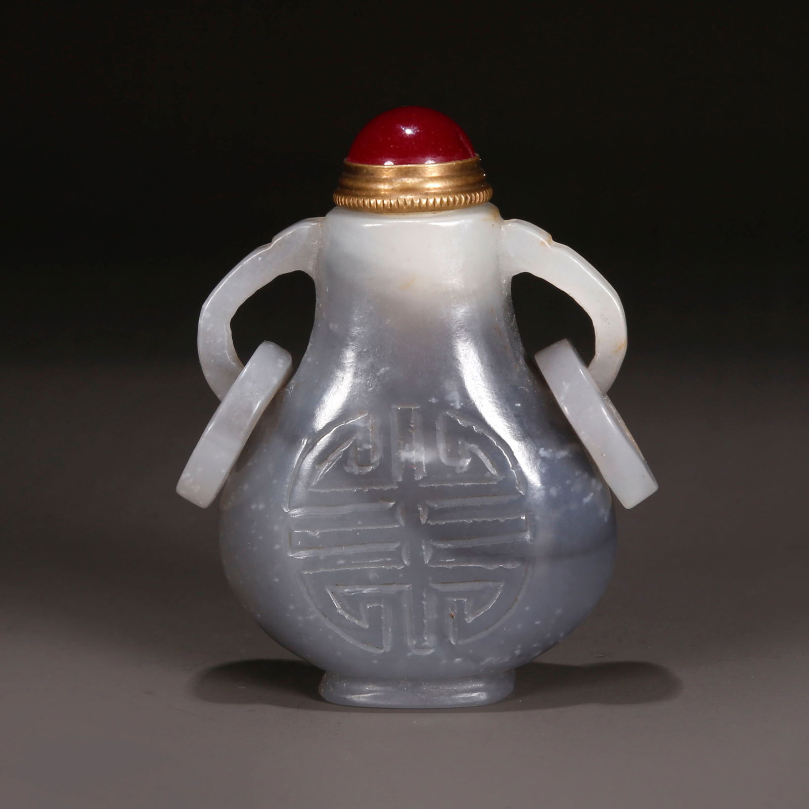 A HETIAN JADE SNUFF BOTTLE, WITH RINGLIKE EARS. (1 of 9)