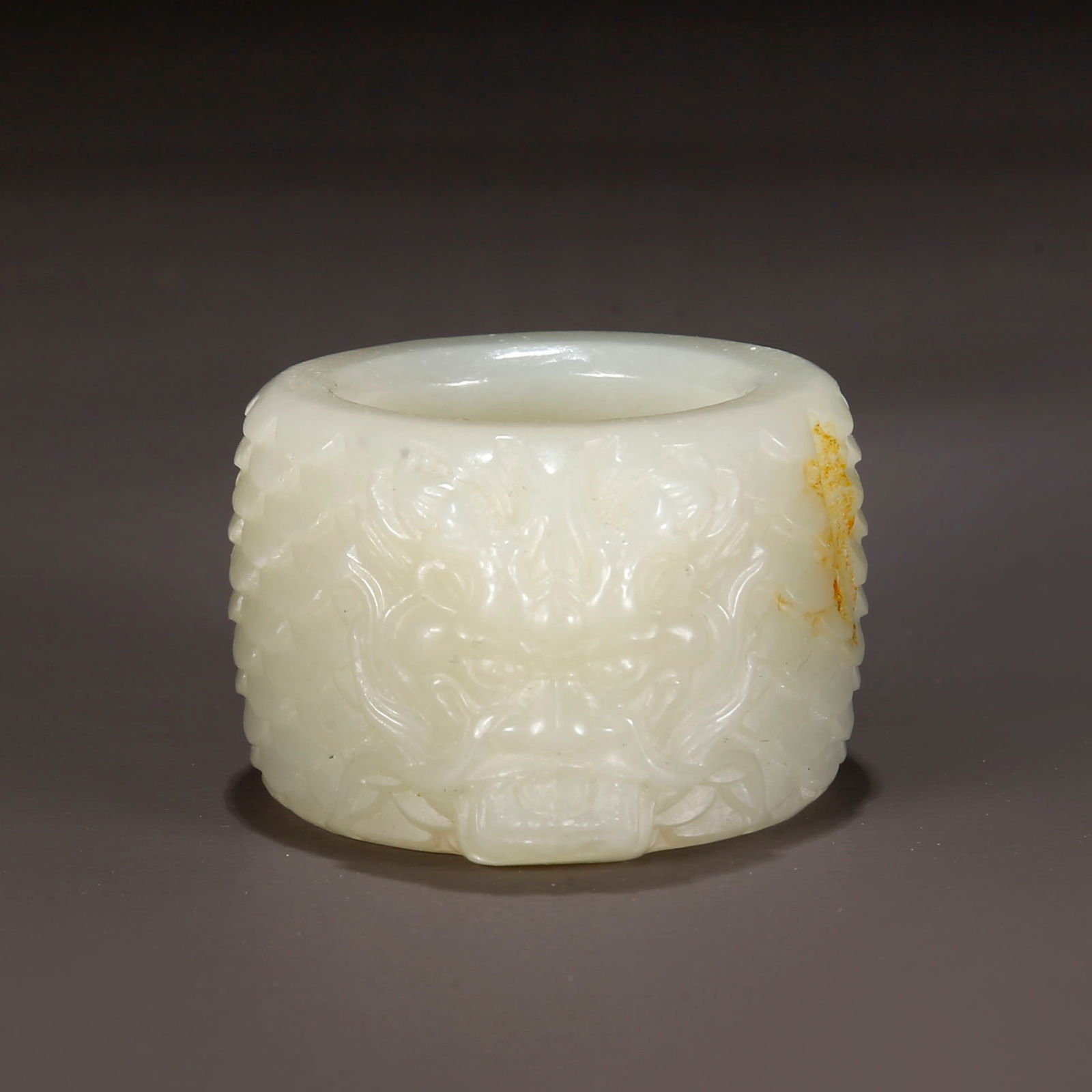A HETIAN JADE THUMB RING, CARVED DRAGON DESIGN. (1 of 9)
