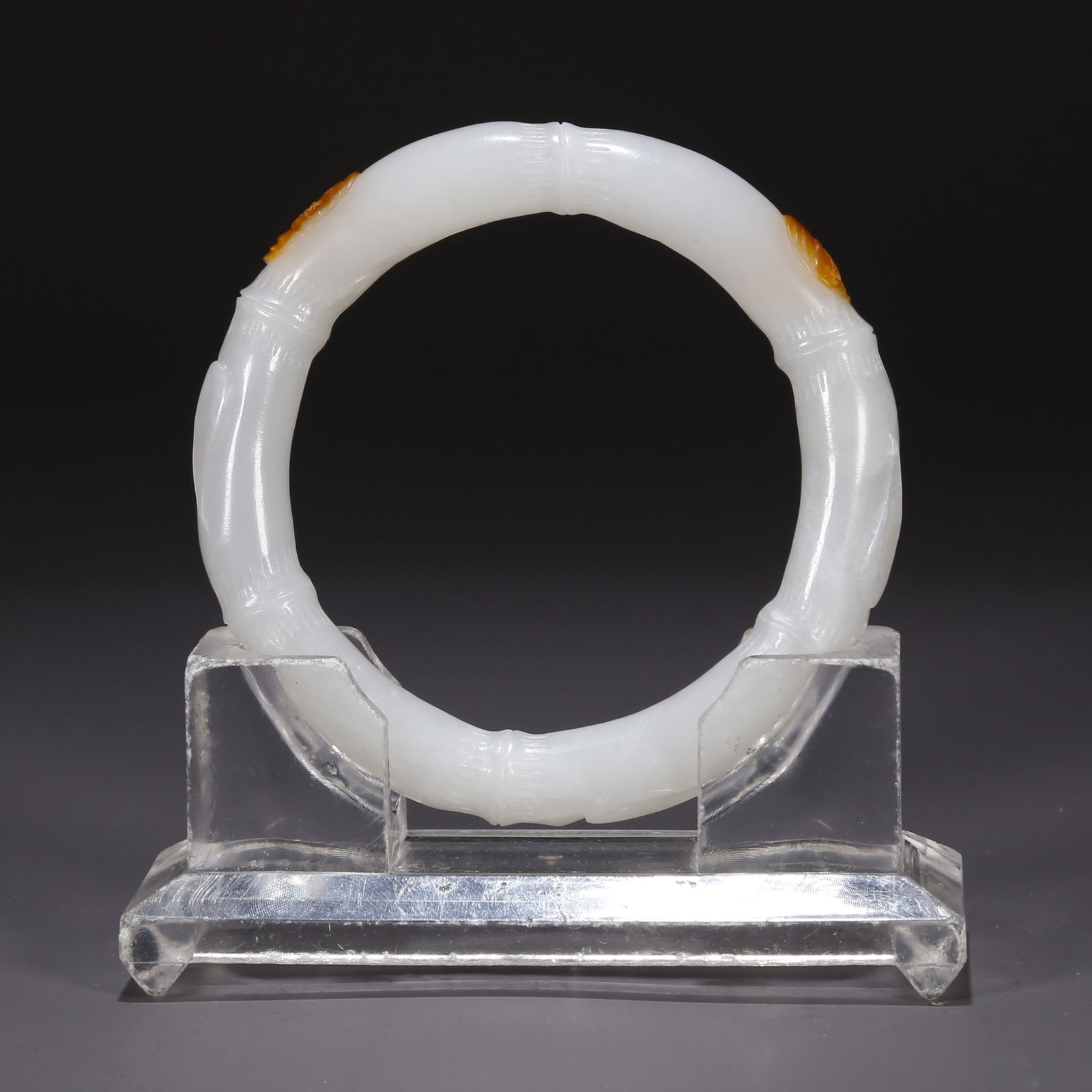 A HETIAN JADE BAMBOO-JOINT-SHAPED BANGLE. (1 of 9)