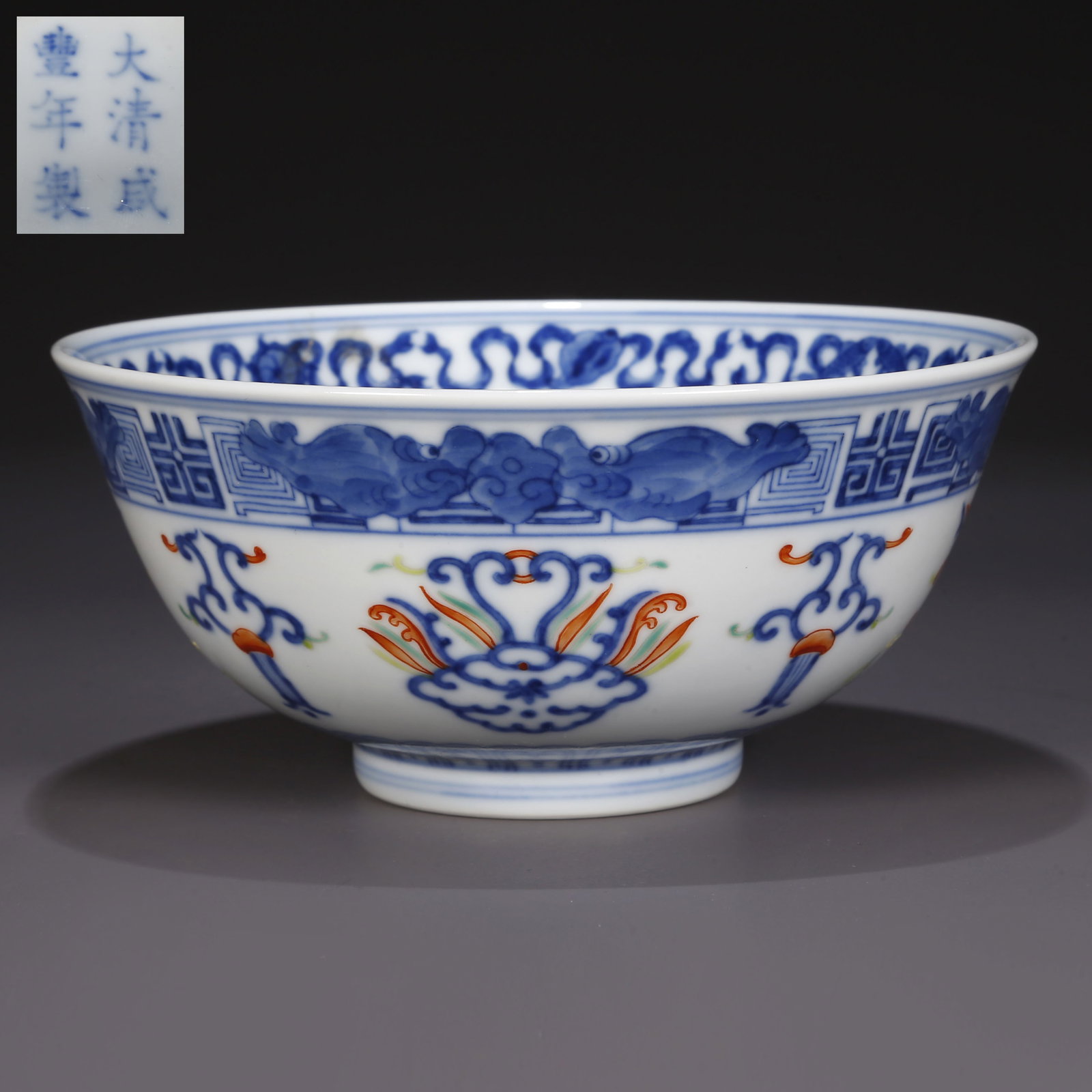 A BLUE-AND-WHITE PORCELAIN BOWL.: Blue-and-White Porcelain Bowl, with Iron-Red Auspicious Symbols Design.