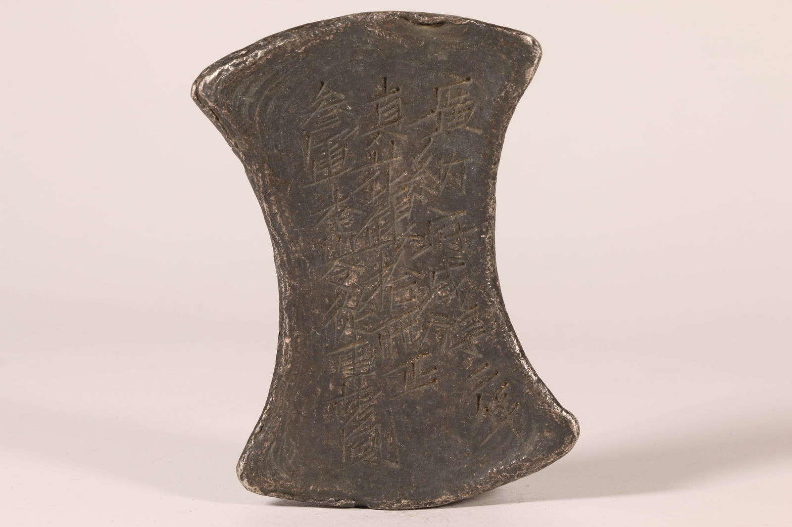 A SILVER INGOT (TEN TAELS) (1 of 6)