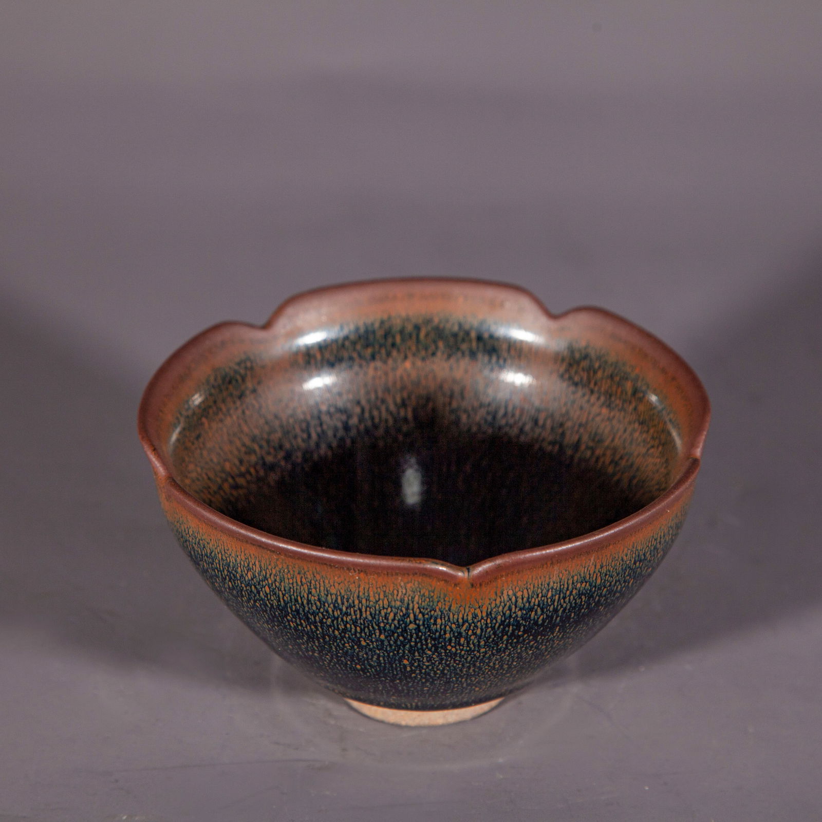 A PORCELAIN CUP, FLOWER-SHAPED BRIM, JIAN KILN. (1 of 7)