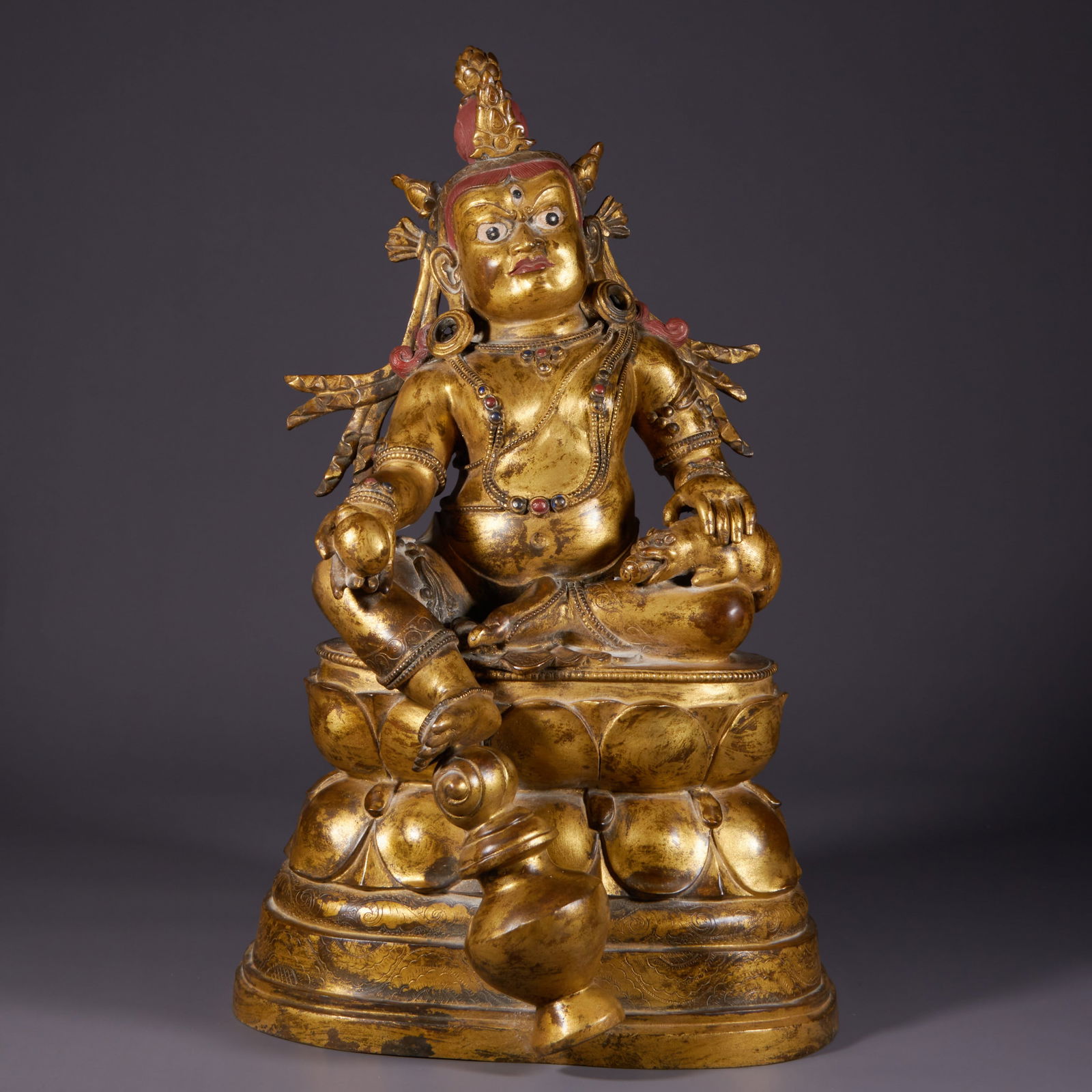 A BRONZE GILT STATUE OF THE YELLOW JAMBHALA (WEALTH GOD). (1 of 8)