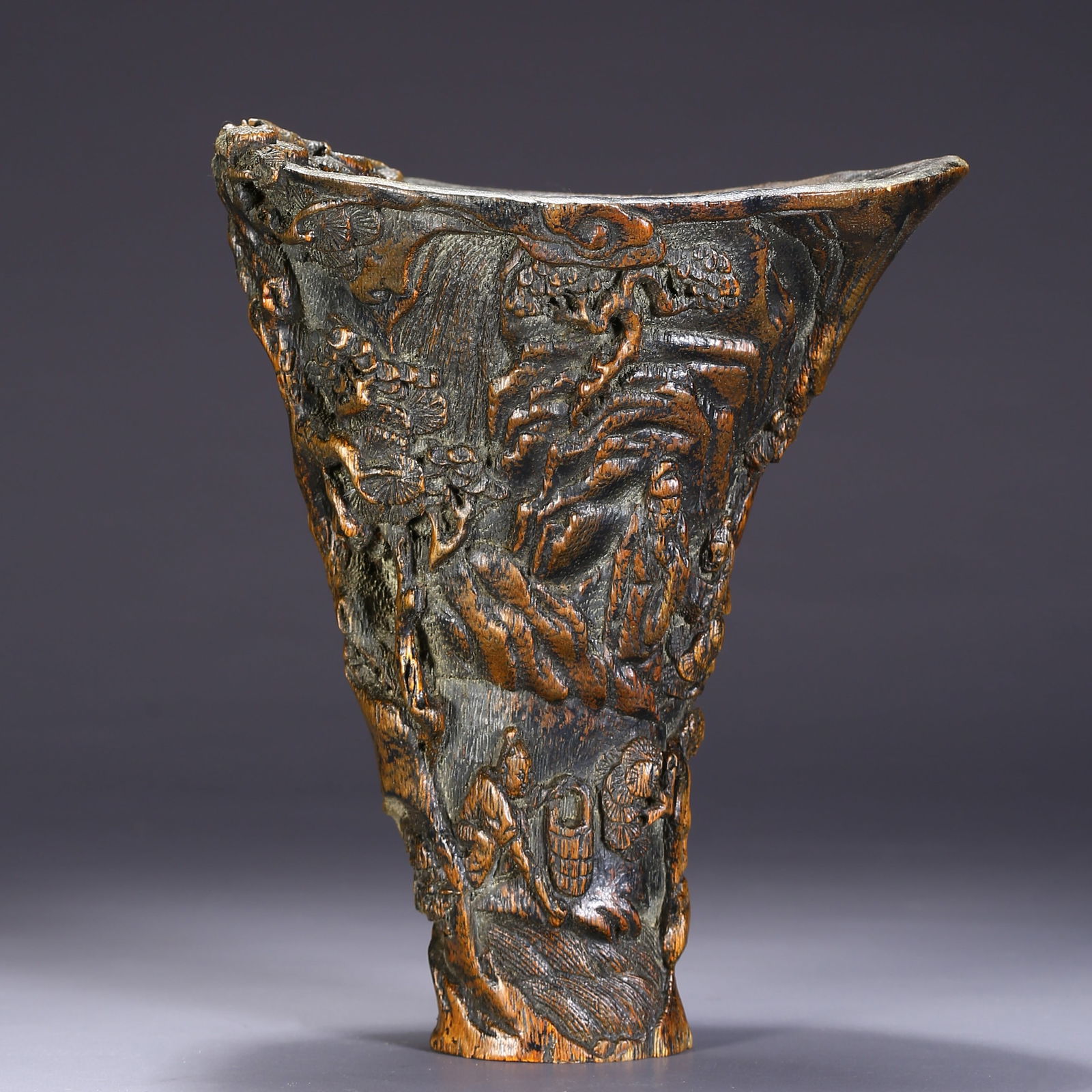 AN AGARWOOD RHINOCEROS HORN CUP WITH HUMAN STORY PATTERN (1 of 9)