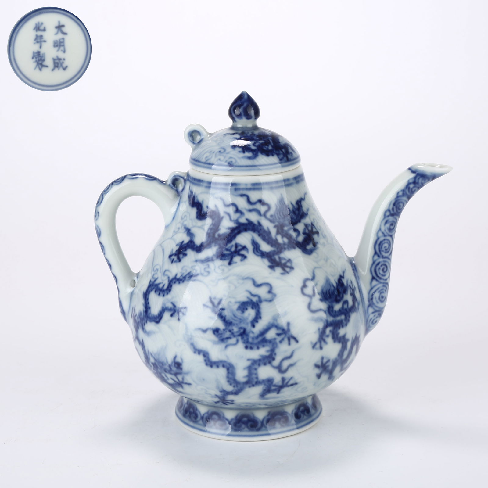 A BLUE AND WHITE EWER WITH CLOUD AND DRAGON DESIGN: Blue and White Ewer with Cloud and Dragon Design